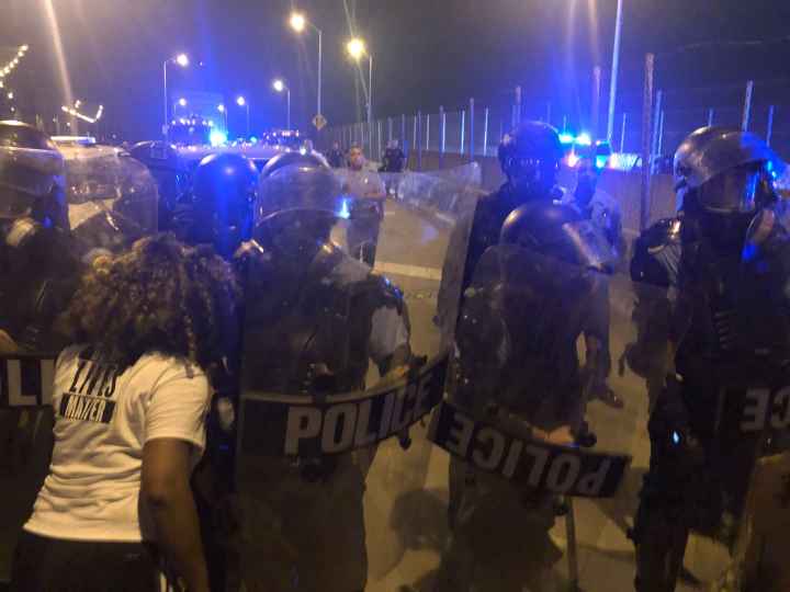 Protesters and police clashing at the CCC bridge in New Orleans 