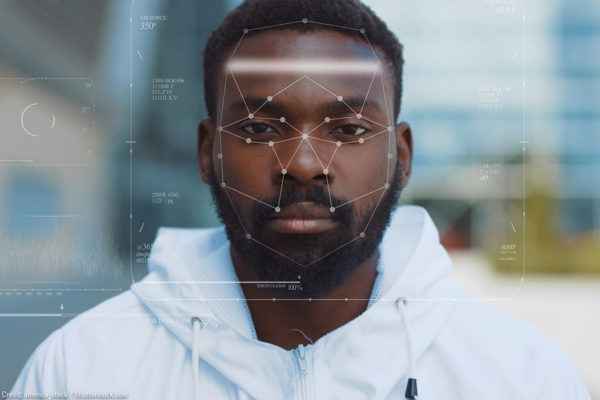 A black man being targeted with facial recognition technology
