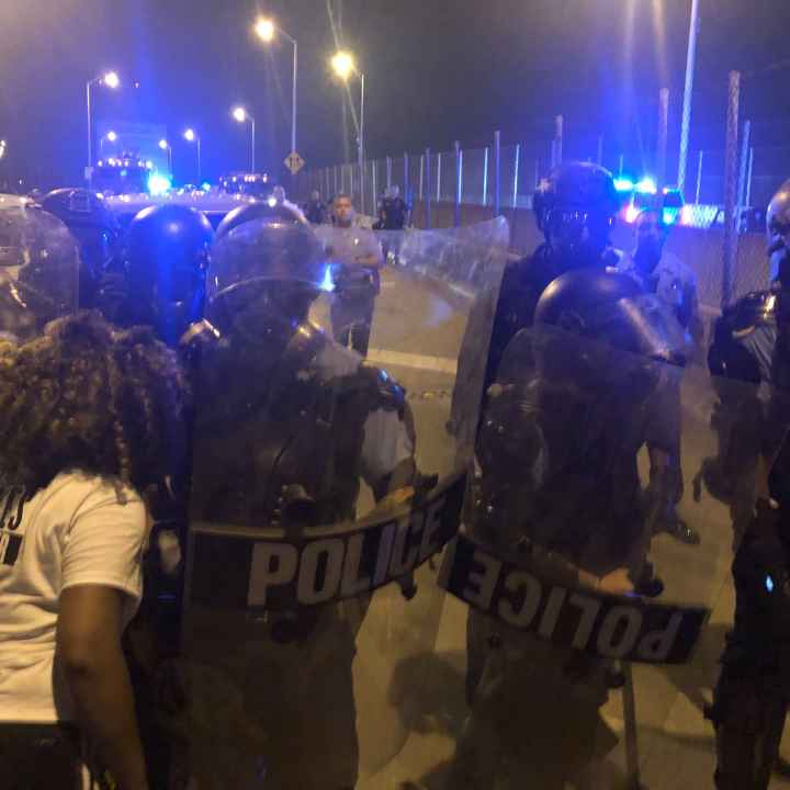 Protesters and police clashing at the CCC bridge in New Orleans 