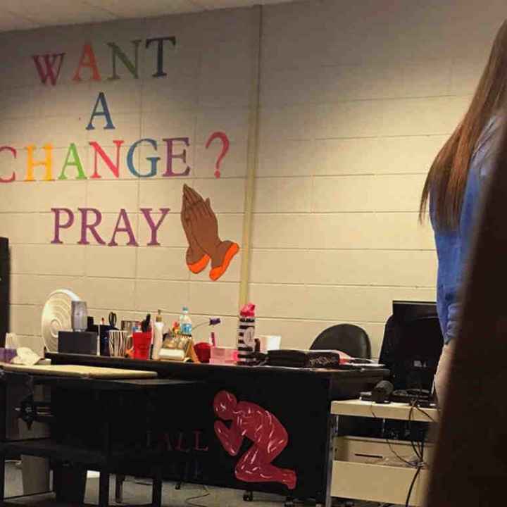 Sign reading "Want a change? Pray" 