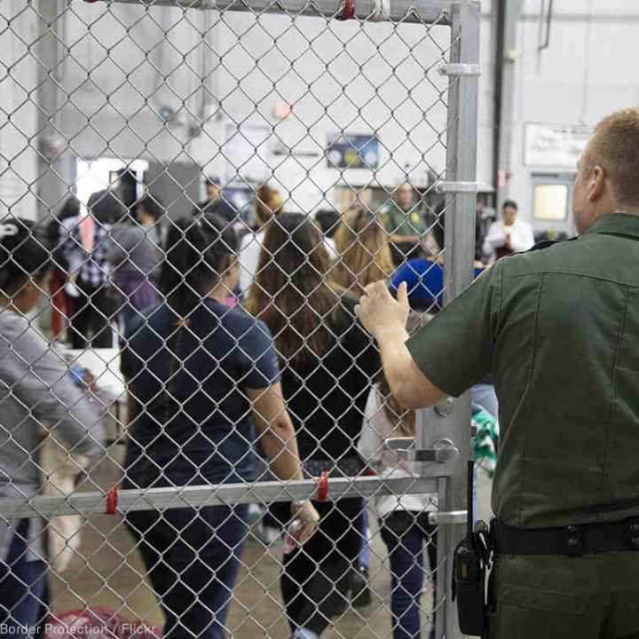 Image of immigrants in a detention facility 